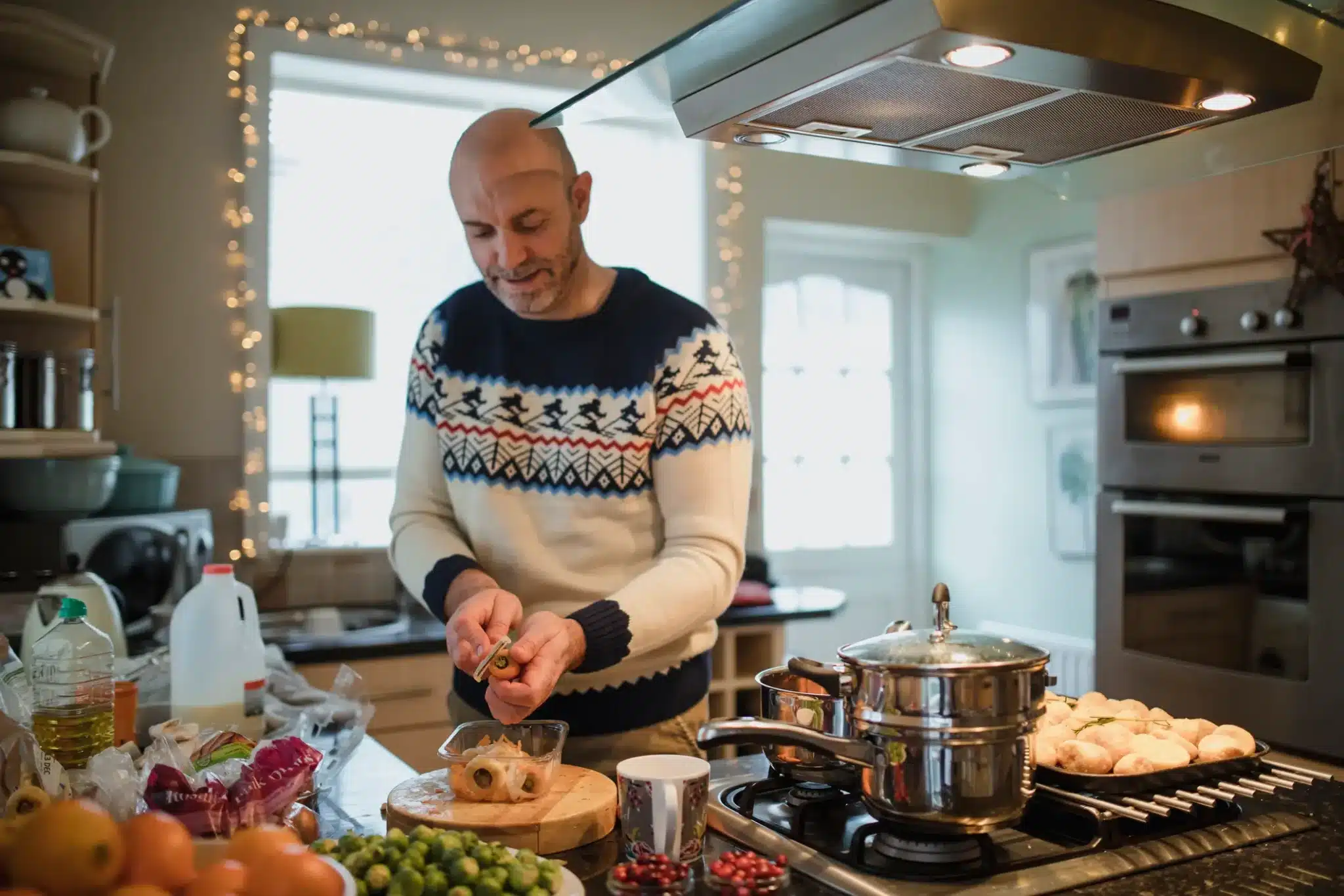 A man cooking for the holiday's for the blog "Optimizing Holiday Comfort: HVAC Cleaning Tips for New Orleans Homes"
