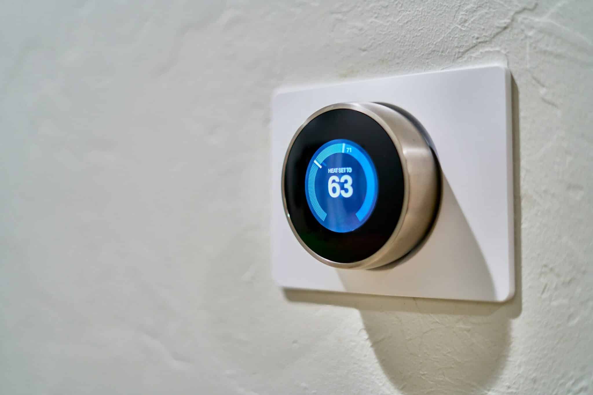 AC Smart Thermostats Are They Worth the Investment: An image of a smart thermostat on a wall.