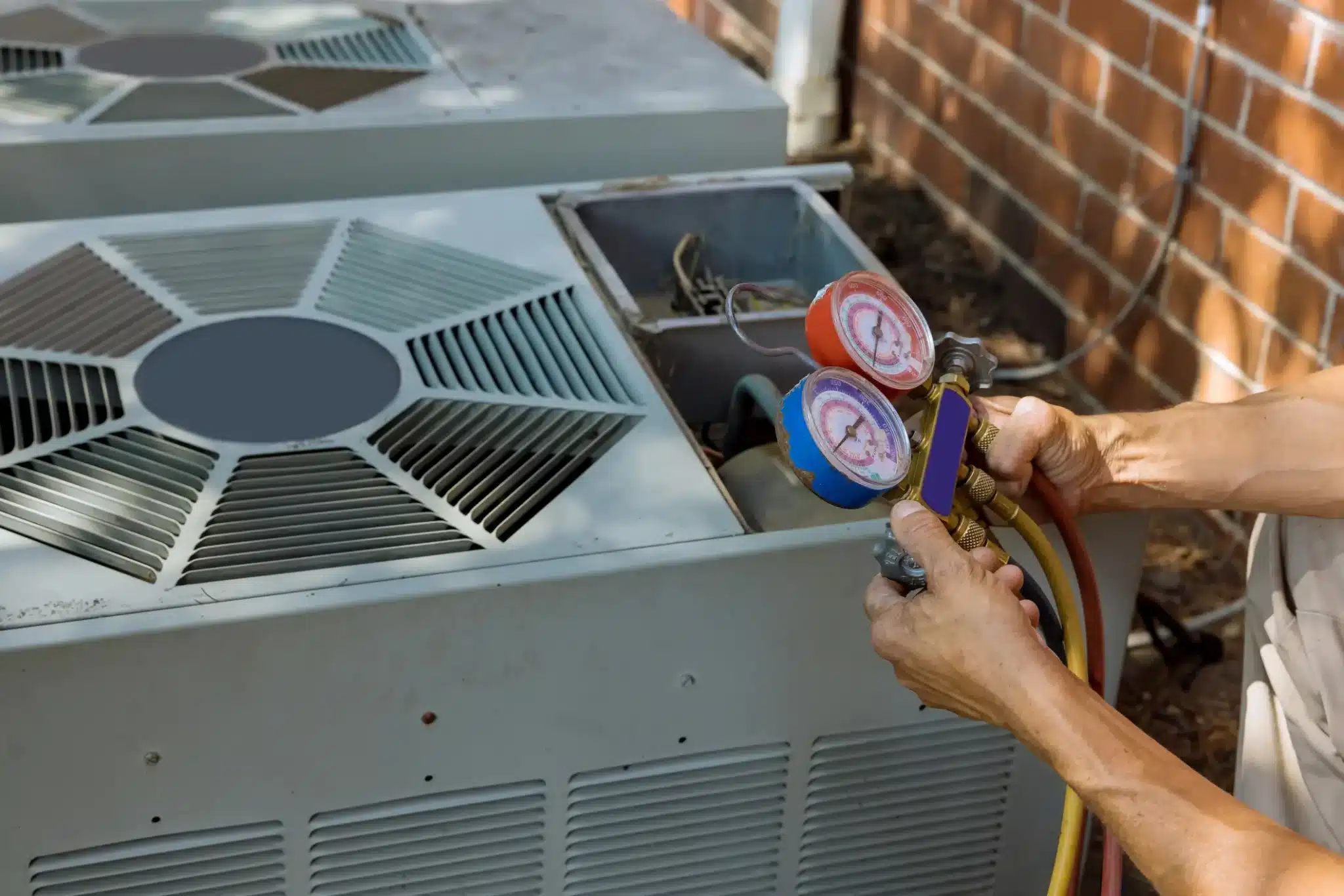 Are AC Maintenance Plans Worth It? Air conditioning technician servicing of preparing to air conditioner